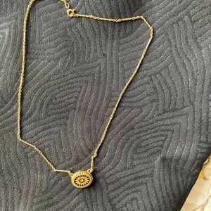 A gold color neckless